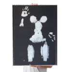 White acrylic body art on black canvas featuring full-body print from Canvas & Curves event